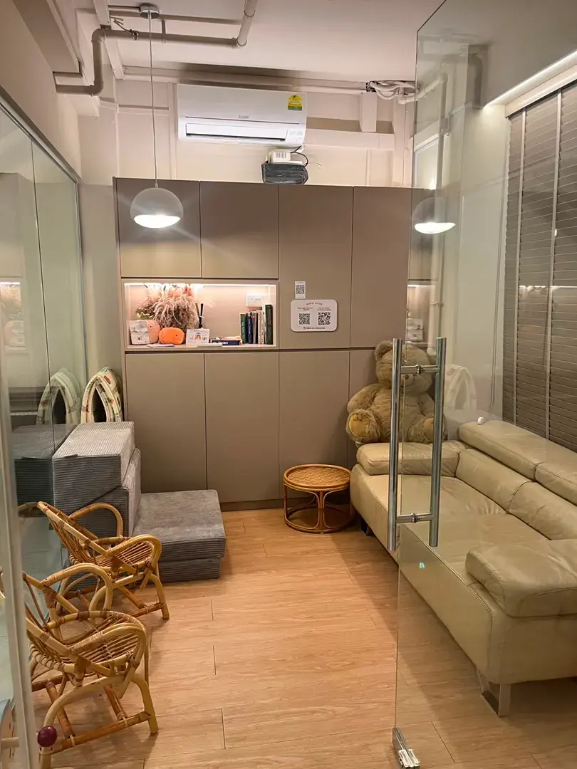 The meeting lounge with sofa seating behind glass