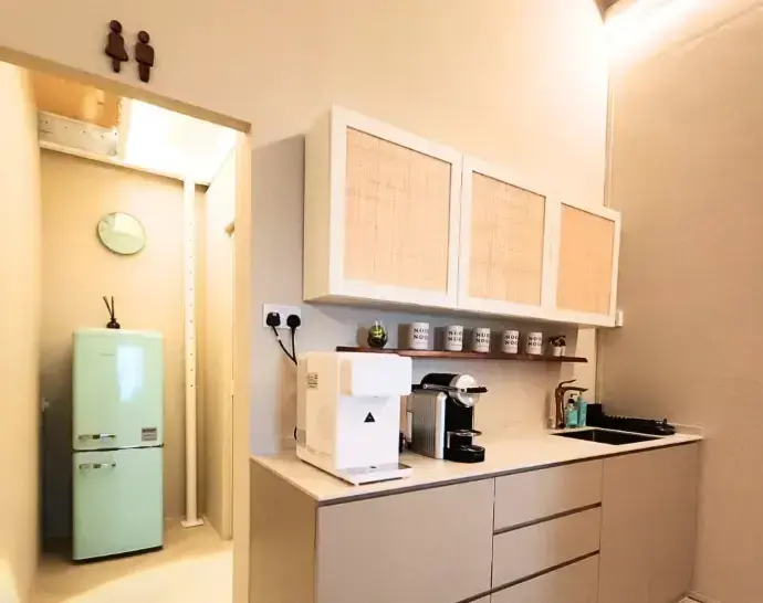 The pantry counter with a mint green retro fridge and a coffee machine