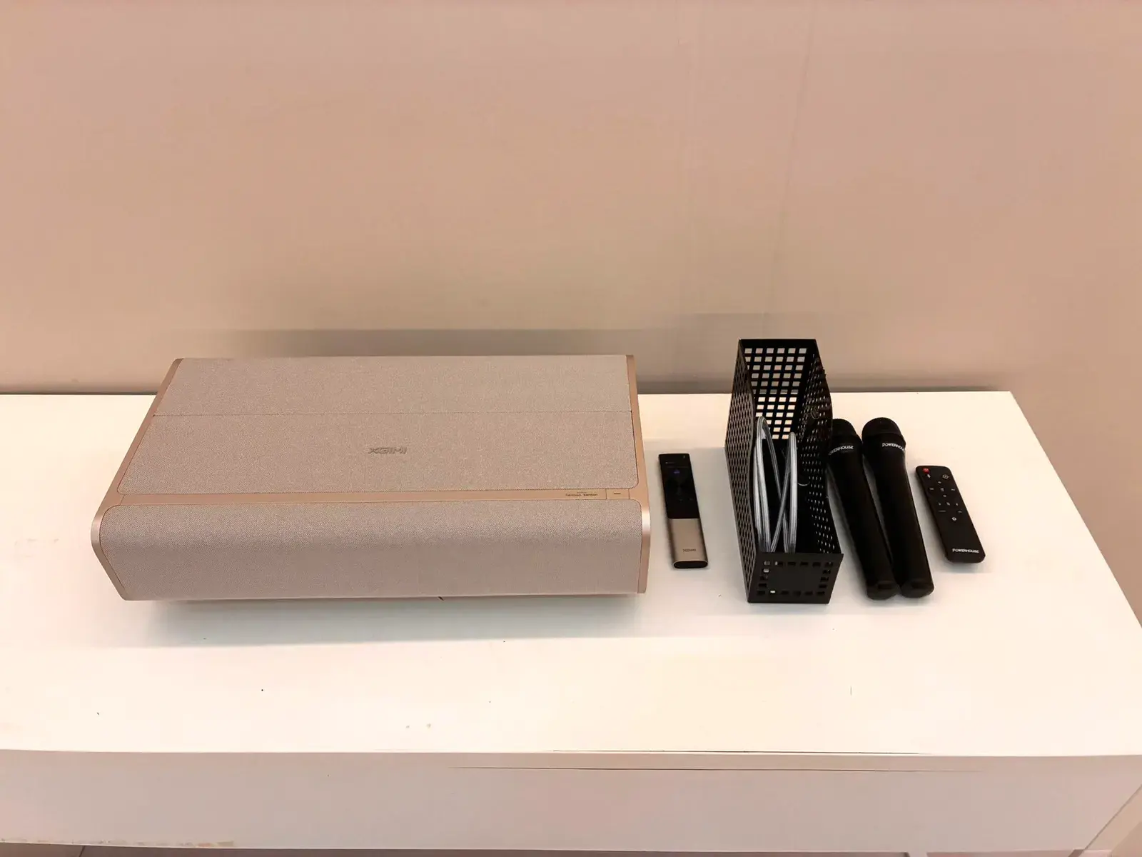 The projector and its remotes on the table