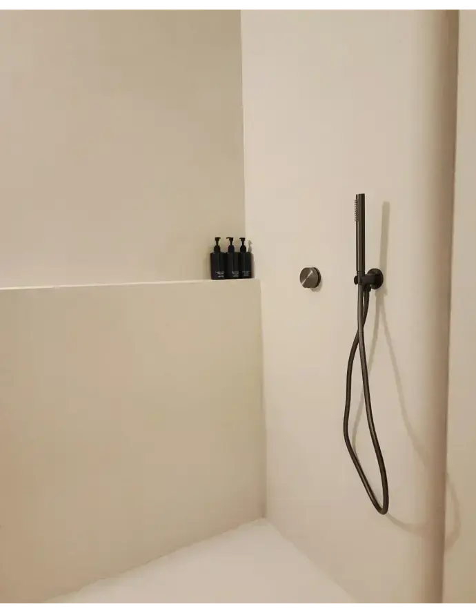 The private restroom with a rain shower fitting